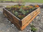 I built a triangle-shaped raise bed for my garden :)) – Reddit Post